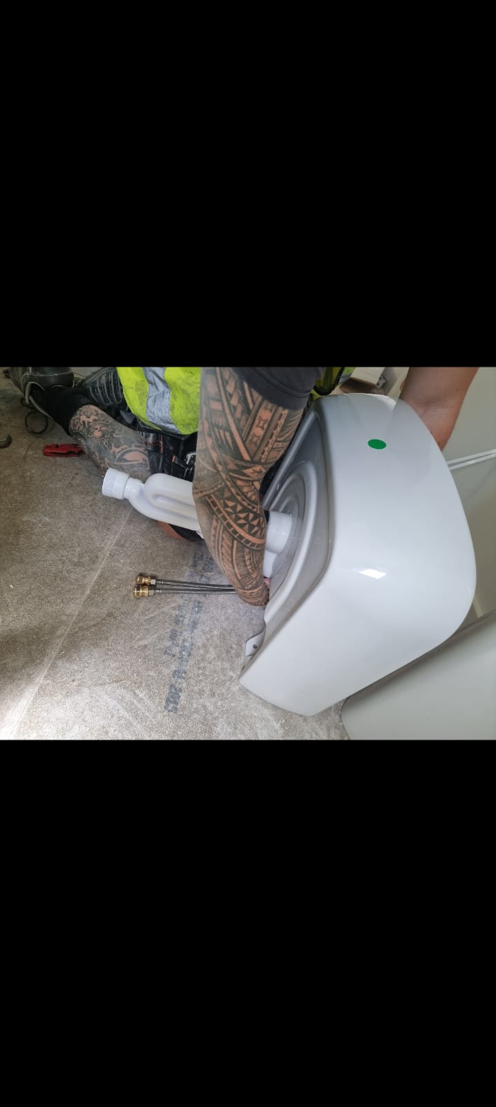 Toilet pan being installed