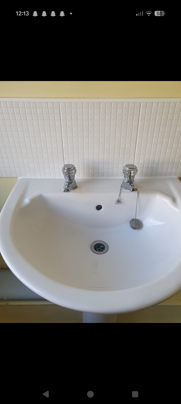 Pedestal basin with chrome pillar taps